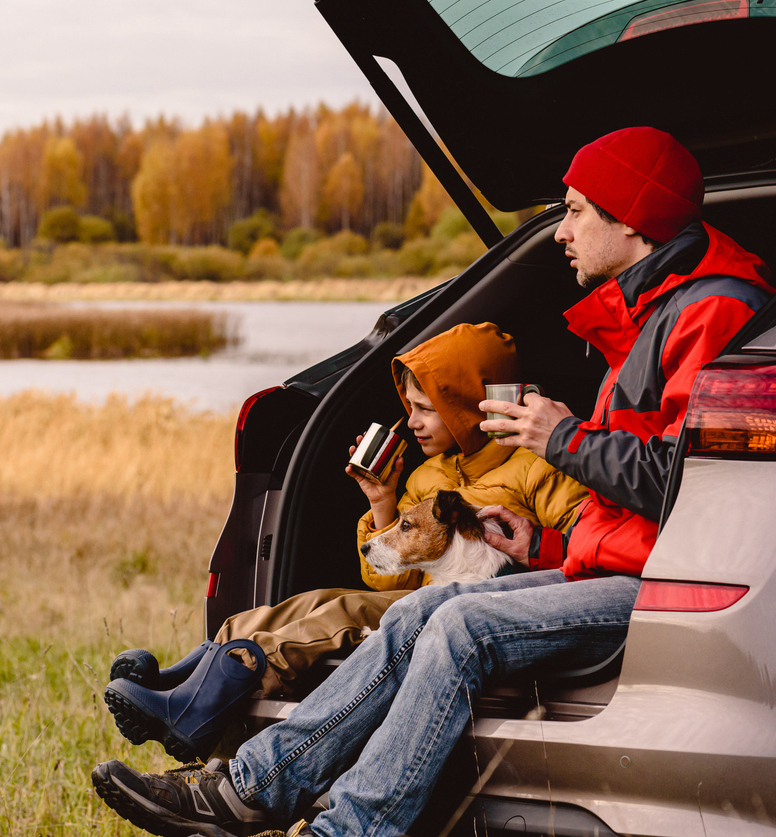 Father and Son sitting in the back of a car